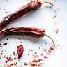 red chili on white surface